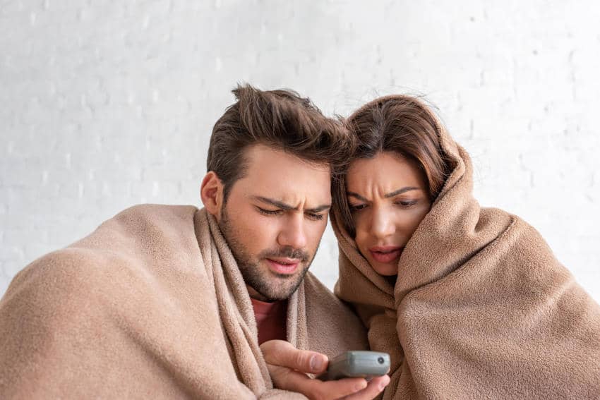 Couple Trying To Warm Up With Blanket-No Unit
